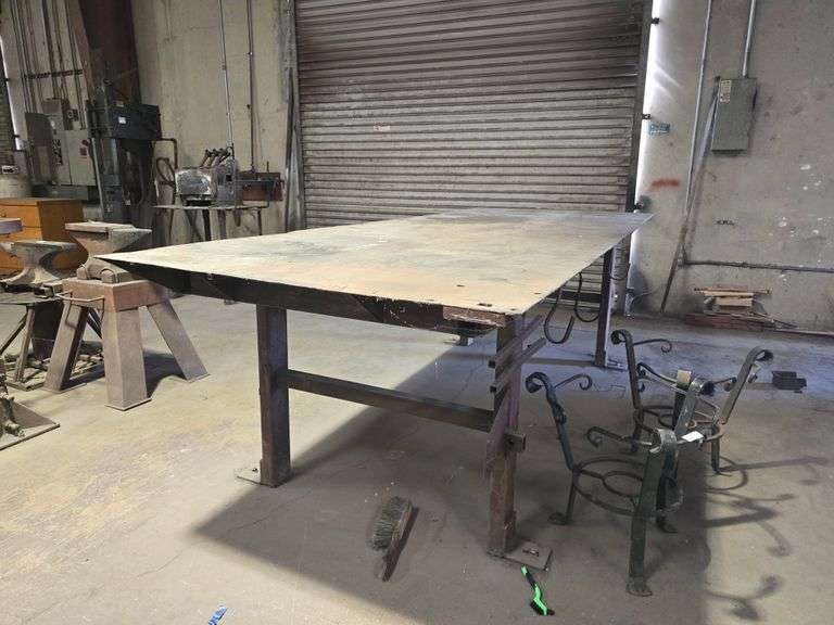 CUSTOM WELDED HEAVY DUTY SOLID METAL WORKBENCH APROX 10'x4'x3'  **IMPORTANT BUYER NOTICE** anchored into concrete floor, buyer responsible for removal EXTREMELY Heavy