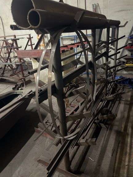 SOLID IRON STOCK PCS.. ABOUT 15+ PCS TOTAL IN LOT WITH SOLID METAL MATERIAL STANDS INCLUDED 5-TIER APROX 117" x 20" x 69"  & 7-TIER APROX 108" x 24" x 66" **sold per stand