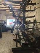 SOLID IRON STOCK PCS INCLUDING PRE TWISTED PIECES.. LONGEST PIECE IN LOT APROX 20'3" WITH ABOUT 30PCS TOTAL IN LOT WITH SOLID METAL MATERIAL STAND 9-TIER APROX 14'4" x 37" x 8'2" INCLUDED