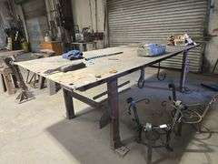 CUSTOM WELDED HEAVY DUTY SOLID METAL WORKBENCH APROX 10'x4'x3'  **IMPORTANT BUYER NOTICE** anchored into concrete floor, buyer responsible for removal EXTREMELY Heavy