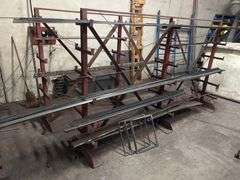 SOLID IRON STOCK PCS.. LONGEST PIECE IN LOT APROX 12' WITH ABOUT 30PCS TOTAL IN LOT WITH SOLID METAL MATERIAL STAND 9-TIER APROX 106" x 16.5" x 67" INCLUDED **sold per stand