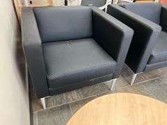 LEATHER-LIKE BLACK LOW LOUNGER APROX 32"SQ x 30"H WITH WHITE METAL LEGS