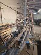SOLID IRON STOCK PCS INCLUDING PRE TWISTED PIECES.. LONGEST PIECE IN LOT APROX 20'3" WITH ABOUT 30PCS TOTAL IN LOT WITH SOLID METAL MATERIAL STAND 9-TIER APROX 14'4" x 37" x 8'2" INCLUDED