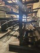 SOLID IRON STOCK PCS INCLUDING PRE TWISTED PIECES.. LONGEST PIECE IN LOT APROX 20'3" WITH ABOUT 30PCS TOTAL IN LOT WITH SOLID METAL MATERIAL STAND 9-TIER APROX 14'4" x 37" x 8'2" INCLUDED