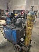 MILLER CP-302 CV DC WELDING POWER SOURCE COMPLETE WITH 22 A 24V WIRE FEEDER, YES WELDER TORCH, CARBON DIOXIDE TANK CABLES ECT