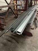 SOLID IRON STOCK PCS.. LONGEST PIECE IN LOT APROX 12' WITH ABOUT 30PCS TOTAL IN LOT WITH SOLID METAL MATERIAL STAND 9-TIER APROX 106" x 16.5" x 67" INCLUDED **sold per stand