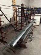 SOLID IRON STOCK PCS.. LONGEST PIECE IN LOT APROX 12' WITH ABOUT 30PCS TOTAL IN LOT WITH SOLID METAL MATERIAL STAND 9-TIER APROX 106" x 16.5" x 67" INCLUDED **sold per stand