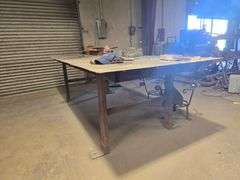 CUSTOM WELDED HEAVY DUTY SOLID METAL WORKBENCH APROX 10'x4'x3'  **IMPORTANT BUYER NOTICE** anchored into concrete floor, buyer responsible for removal EXTREMELY Heavy