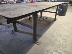 CUSTOM WELDED HEAVY DUTY SOLID METAL WORKBENCH APROX 10'x4'x3'  **IMPORTANT BUYER NOTICE** anchored into concrete floor, buyer responsible for removal EXTREMELY Heavy