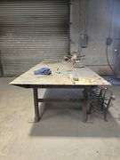 CUSTOM WELDED HEAVY DUTY SOLID METAL WORKBENCH APROX 10'x4'x3'  **IMPORTANT BUYER NOTICE** anchored into concrete floor, buyer responsible for removal EXTREMELY Heavy