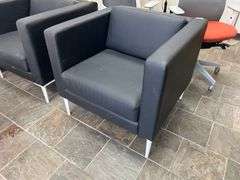 LEATHER-LIKE BLACK LOW LOUNGER APROX 32"SQ x 30"H WITH WHITE METAL LEGS