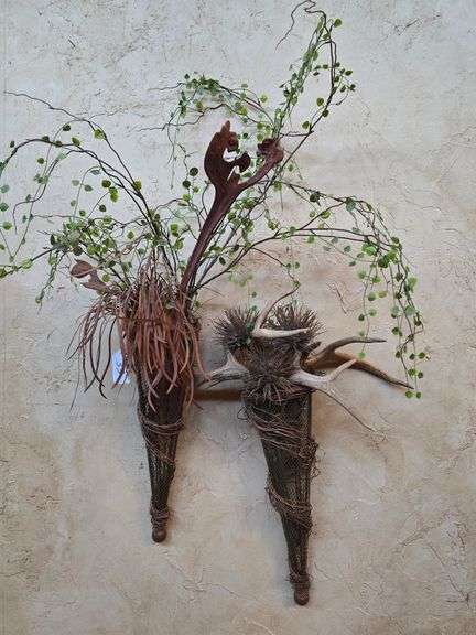Vintage appearing wall hanging plant holders with fake plants and deer antler included
