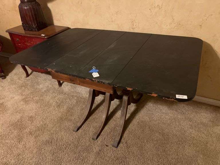 Solid wooden black vintage table with 3-center legs aprox 55"x3'x28"