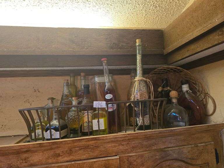 All Bottles and Racks Pictured on Top of Cabinets