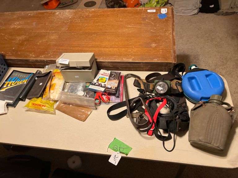 Various home goods including hunting hear, gloves, hardware, ect