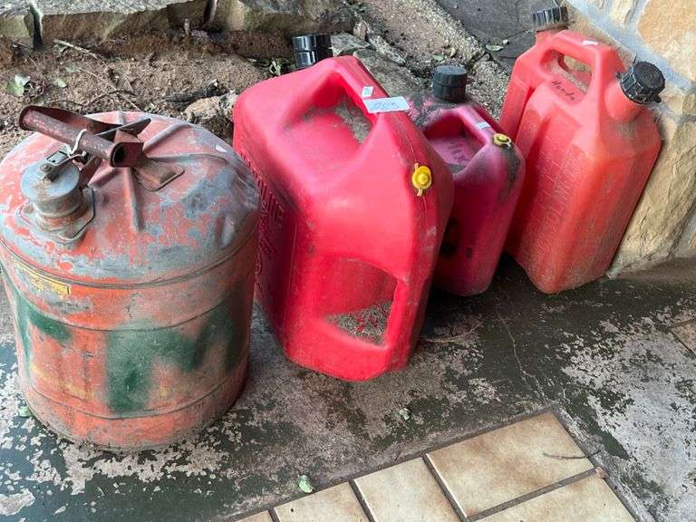 Variety of gas cans, including vintage metal can