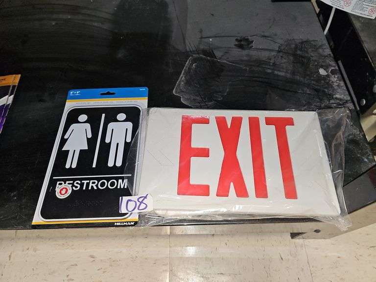 NEW SIGNS INCLUDING WHITE WITH RED LETTERING EXIT SIGN, AND HILLMAN 6"x9" RESTROOM SIGN