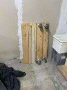 WOODEN PLANKS INCLUDING 2-WHEEL DOLLIES APROX 4' ; AND LARGE WOODEN PORTABLE WALL
