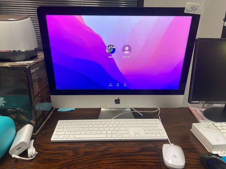 APPLE ALL IN ONE MONITOR COMPUTER MODEL A2116 POWERS ON WITH POWER CABLE, USB HP KEYBOARD & MOUSE INCLD.