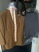 MEN'S PADDED SHOULDER SUIT JACKETS MANY AROUND SIZE 45 S, BRANDS SUCH AS MAZARI, ANGELO ROSSI, FALCONE FULL TUX, ECT SOME WITH MATCHING PANTS.. LOT ALSO INCLUDES TIES, SHIRTS, BELTS, AND WALLETS! **SOLD PER JACKET WITH EXTRAS INCLUDED