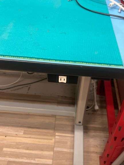 PHOENIX WORKSTATIONS 2-TIER WORKBENCH WITH ANTI STATIC MAT AND GROUNDING SPOT.. ELECTRONIC HEIGHT ADJUSTMENT AND EXTENSION STRIP MOUNTED APPROX 6' x 32" x 7'