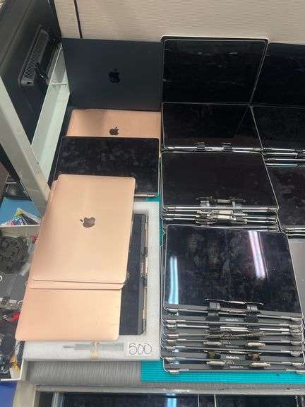 HUGE ASSORTMENT OF APPLE LAPTOP SCREENS INCLUDING SOME FULL LAPTOPS IN LOT, SOLD PER SCREEN lot includes everything on top of and inside of filing cabinets