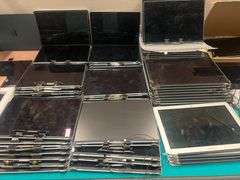 HUGE ASSORTMENT OF APPLE LAPTOP SCREENS INCLUDING SOME FULL LAPTOPS IN LOT, SOLD PER SCREEN lot includes everything on top of and inside of filing cabinets