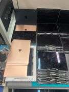HUGE ASSORTMENT OF APPLE LAPTOP SCREENS INCLUDING SOME FULL LAPTOPS IN LOT, SOLD PER SCREEN lot includes everything on top of and inside of filing cabinets