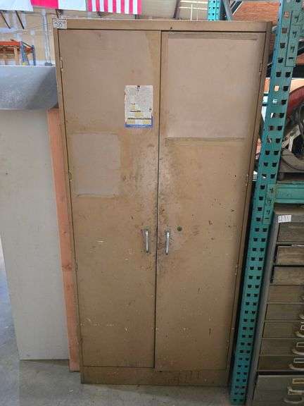 METAL STORAGE CABINET WITH 2-DOORS AND 6- SHELVES WITH PAINTING SUPPLIES APROX 3'x18"x78"