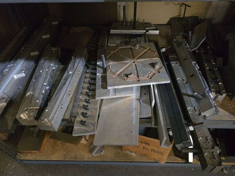 PLASTIC INJECTION DIE MOLDS IN A VARIETY OF SIZES AND SHAPES WITH DROP IN SHELVING UNIT INCLD.