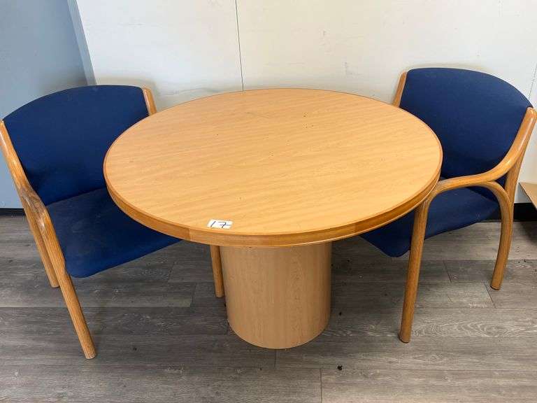 WOODEN ROUND TABLE APROX 42"DIA x 29" WITH (2) MATCHING WOODEN CHAIRS WITH BLUE FABRIC CUSHION