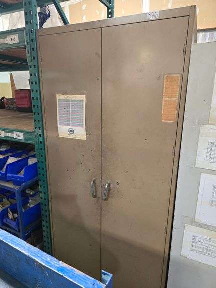 METAL STORAGE CABINET WITH 2-DOORS AND 5-INNER SHELVES FULL OF MARKING SUPPLIES APROX 3'x18"x78"
