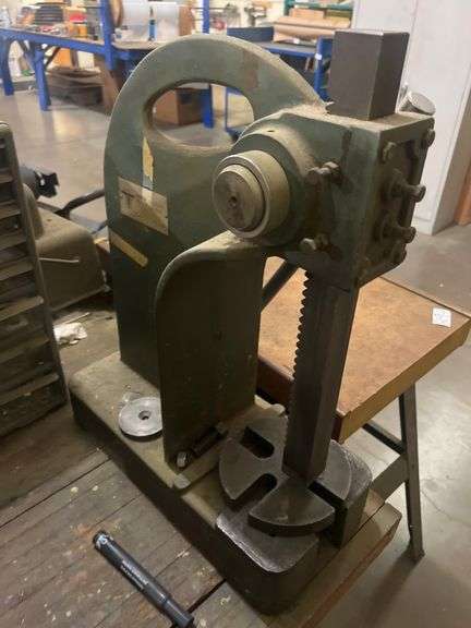 UNITED YUASA INTERNATIONAL INC. 595-00 ARBOR PRESS MOUNTED TO TABLE BUYER RESPONSIBLE TO REMOVE
