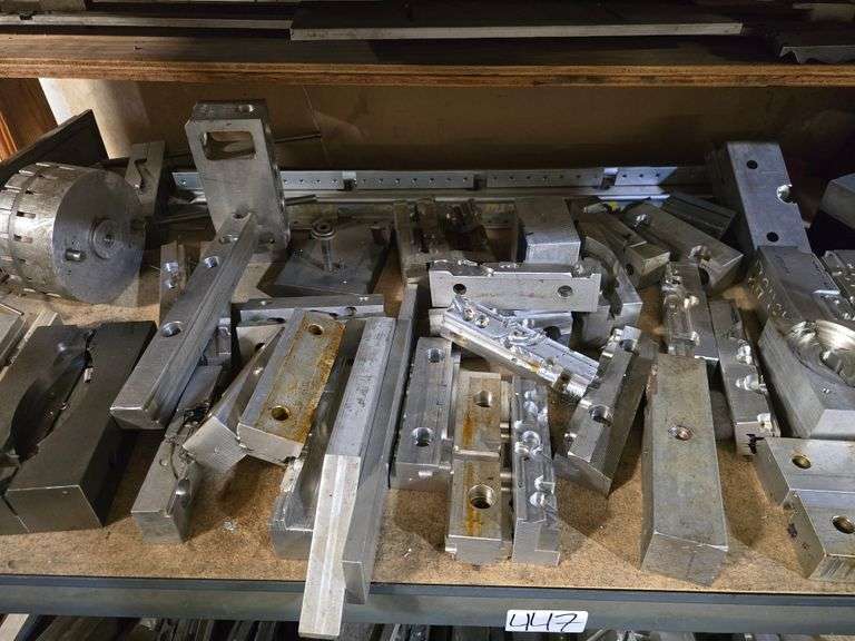 PLASTIC INJECTION DIE MOLDS IN A VARIETY OF SIZES AND SHAPES WITH DROP IN SHELVING UNIT INCLD.