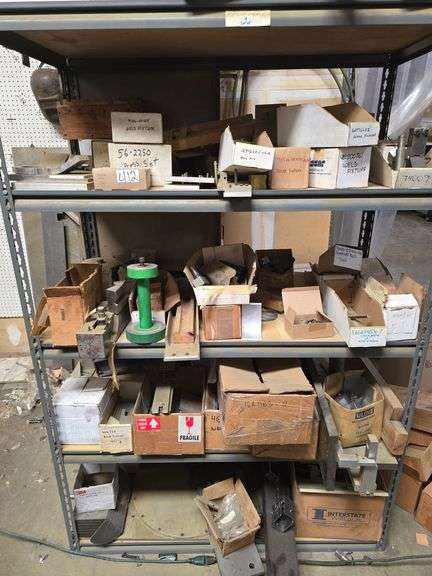 MILITARY SPEC TEST FIXTURES IN A VARIETY OF FERROUS AND NON-FERROUS METAL MATERIALS, EVERYTHING ON SHELVING UNIT IS INCLD.