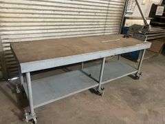 WORK BENCH WITH WHEELS AND PEGS FOR STATIONARY USE, WITH WOODWARD FAB FASTENER TOOL ATTACHED TO TABLE