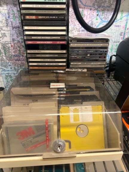 VARIETY OF CDS AND FLOPPY DISC WITH HOLDER INCLD.
