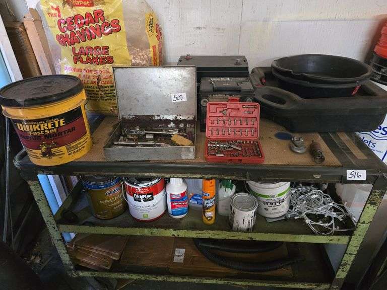 CONTENTS OF SHELF INCLUDING BIT SET OIL PANS CEDAR SHAVINGS PAINT BATTERIES ECT