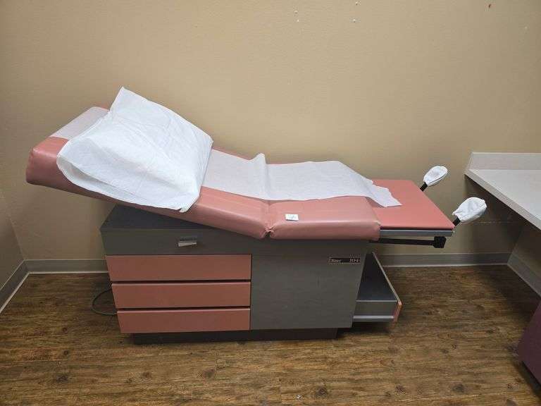 RITTER 104 EXAM TABLE WITH STIRRUPS & 5-DRAWERS FULL OF VARIOUS SUPPLIES APROX 53"x27"x44"