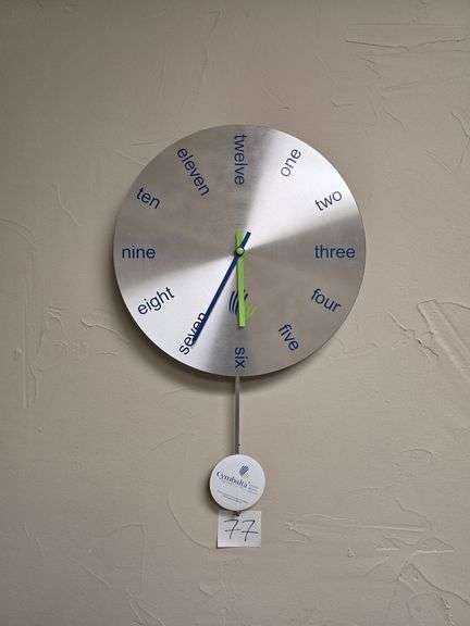 CYMBALTA THEMED WALL CLOCK APROX 12"DIA FACE