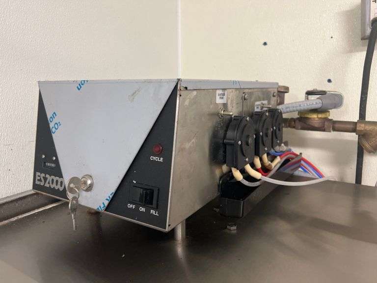 ECOLAB ES-2000 COMMERCIAL DISHWASHING MACHINE WITH NSF METAL ATTACHMENTS INCLUDED AS WELL AS (4) TRAYS.. **TOOLS LIKELY NEEDED FOR REMOVAL, BUYER RESPONSIBLE FOR DISCONNECT