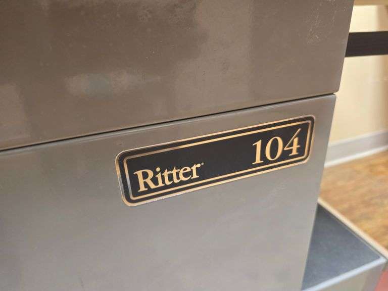 RITTER 104 EXAM TABLE WITH STIRRUPS & 5-DRAWERS FULL OF VARIOUS SUPPLIES APROX 53"x27"x44"