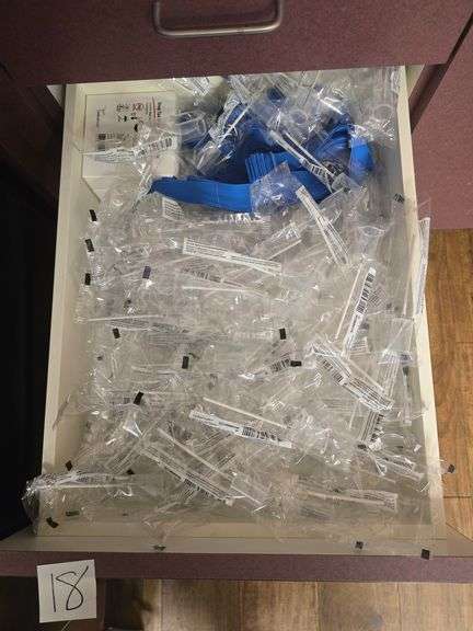 CONTENTS OF DRAWER INCLUDE CARDINAL HEALTH URINE TRANSFER DEVICE CHBIWUS100 AND STRAP TORNIQUETS
