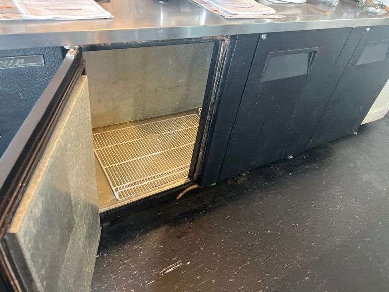 TRUE 3-DOOR KEG COOLER ON CASTORS APROX 90"x28"x40" IN GREAT WORKING CONDITION, SOME SHELVING INCLD.