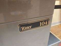 RITTER 104 EXAM TABLE WITH STIRRUPS & 5-DRAWERS FULL OF VARIOUS SUPPLIES APROX 53"x27"x44"