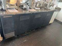 TRUE 3-DOOR KEG COOLER ON CASTORS APROX 90"x28"x40" IN GREAT WORKING CONDITION, SOME SHELVING INCLD.