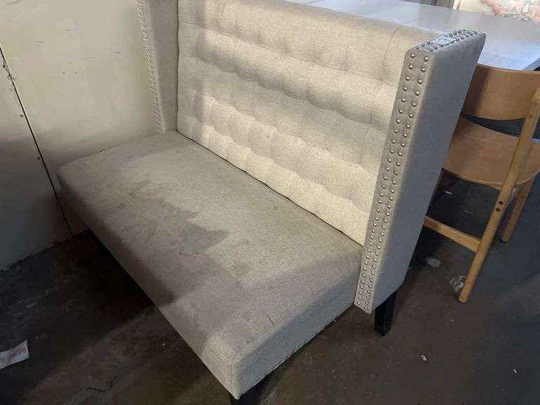 MODERN UPHOLSTERED BOOTH SEATING APROX 46"x25"x39" WITH METAL BUTTON ACCENT AND BLACK WOODEN LEGS
