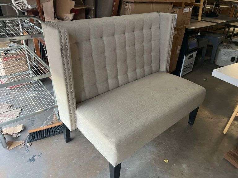 MODERN UPHOLSTERED BOOTH SEATING APROX 46"x25"x39" WITH METAL BUTTON ACCENT AND BLACK WOODEN LEGS