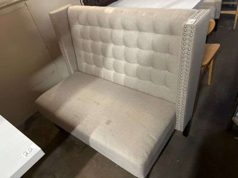 MODERN UPHOLSTERED BOOTH SEATING APROX 46"x25"x39" WITH METAL BUTTON ACCENT AND BLACK WOODEN LEGS