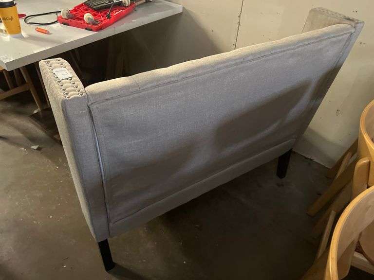 MODERN UPHOLSTERED BOOTH SEATING APROX 46"x25"x39" WITH METAL BUTTON ACCENT AND BLACK WOODEN LEGS
